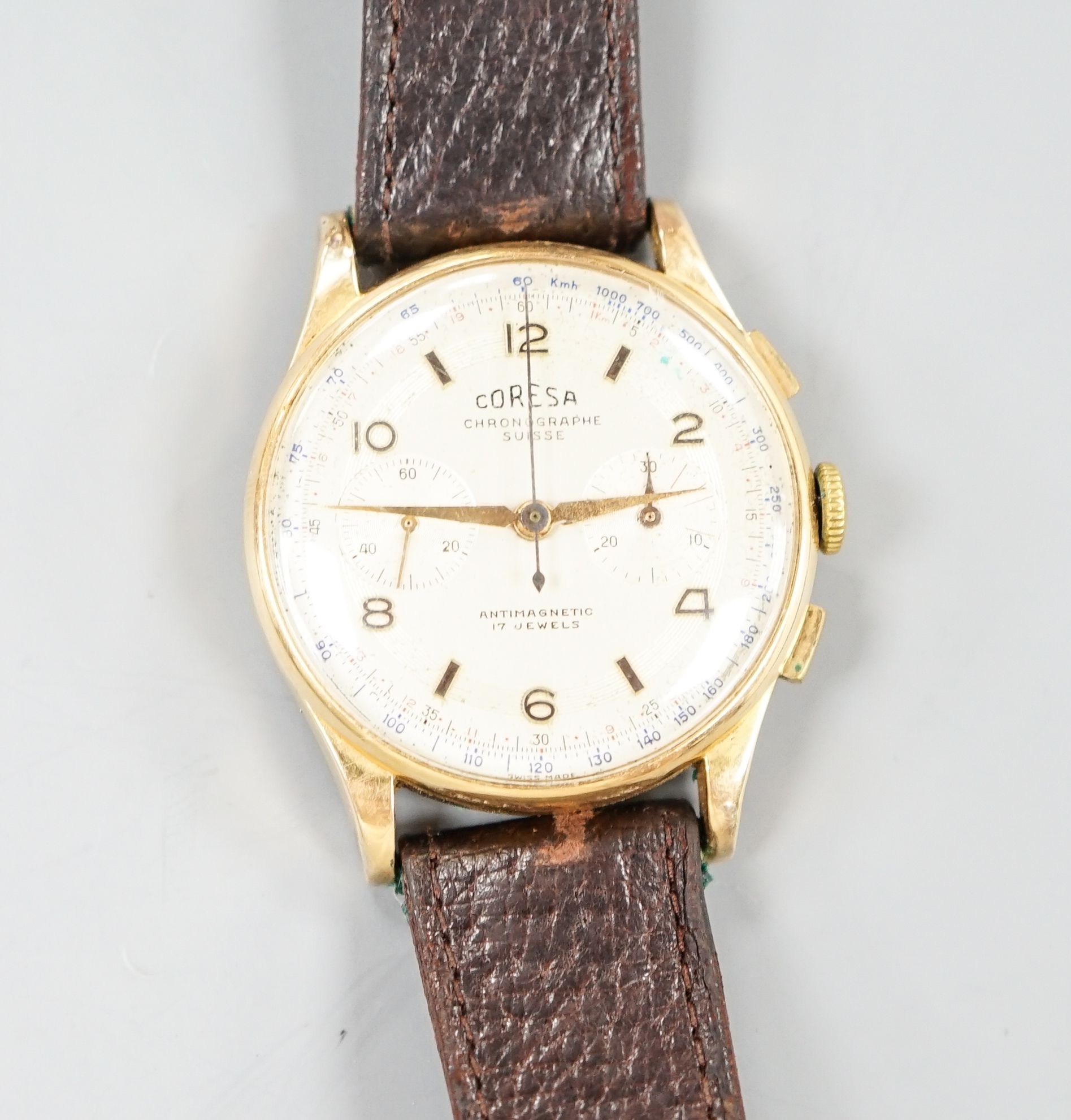 A gentleman's Swiss yellow metal Coresa manual wind chronograph wrist watch (back missing), case diameter 37mm, on associated leather45.2 grams, strap, gross weight